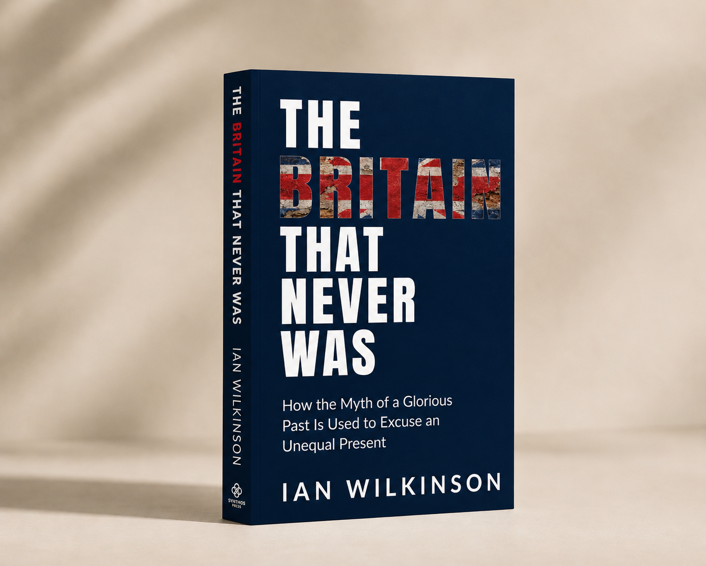 The Britain That Never Was by Ian Wilkinson, paperback book mockup on a warm editorial surface